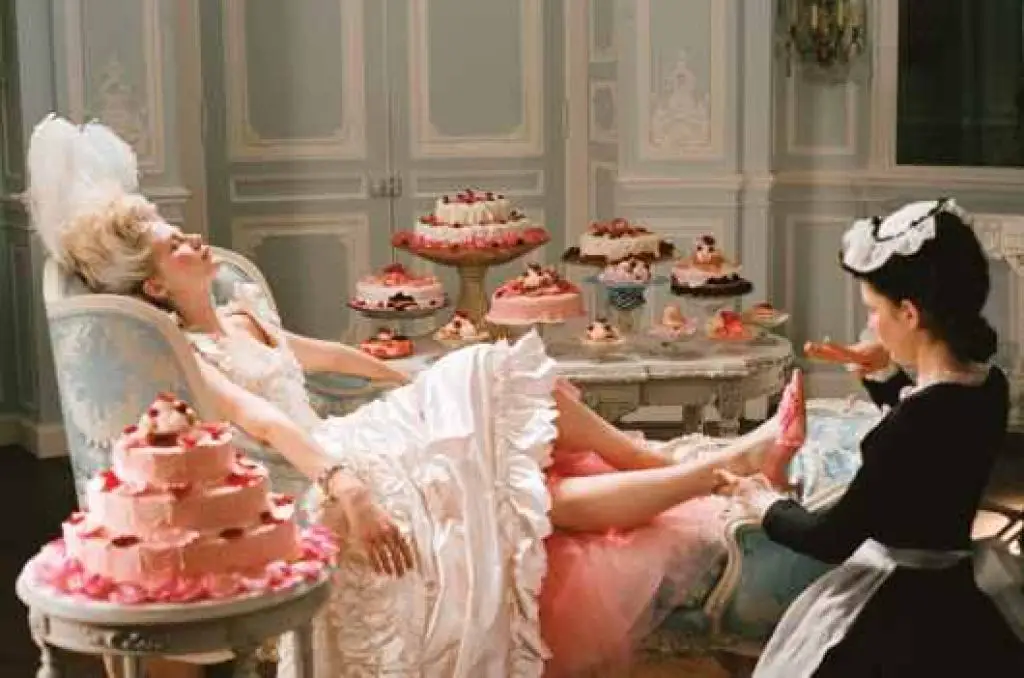 Marie antoinette in a room full of cake
